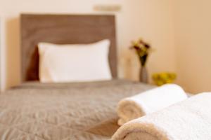 Postel nebo postele na pokoji v ubytování Nikos Hotel