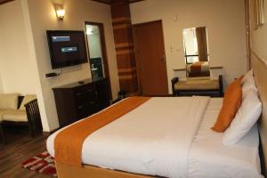 Voodi või voodid majutusasutuse Hotel Broadways Inn toas