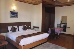 Voodi või voodid majutusasutuse Hotel Broadways Inn toas