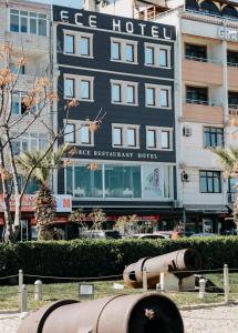 a building with a sign on the side of it at Ece Hotel Eceabat in Eceabat