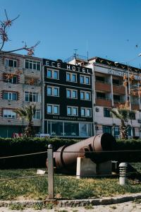 a large building with a pipe in front of it at Ece Hotel Eceabat in Eceabat