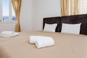 Postel nebo postele na pokoji v ubytování Nikos Hotel
