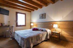 Postel nebo postele na pokoji v ubytování Agriturismo Noiari