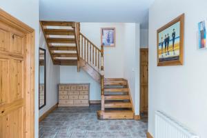 a staircase in a room with a stair case at Portbeg Holiday Homes at Donegal Bay in Bundoran