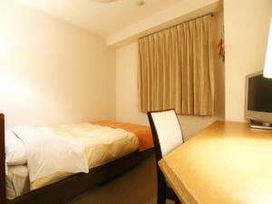 Postel nebo postele na pokoji v ubytování Hotel New Ueno