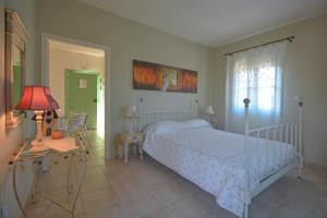 Postel nebo postele na pokoji v ubytování Anemohadi Apartments