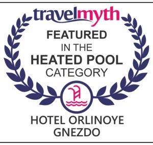 a logo for a heated pool category with a laurel wreath at Hotel Orlinoye Gnezdo in Subottsi