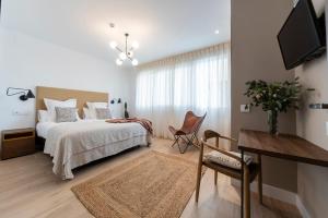 Posteľ alebo postele v izbe v ubytovaní Real Segovia Apartments by Recordis Hotels