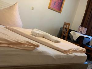 Postel nebo postele na pokoji v ubytování Hotel Restaurant Memo