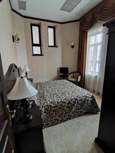 Кровать или кровати в номере Hotel Carol