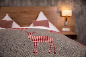 Voodi või voodid majutusasutuse Genusshotel Hirschen - Erholung im Grünen (Südschwarzwald) toas