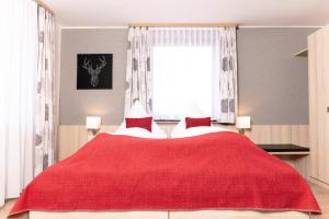 Voodi või voodid majutusasutuse Genusshotel Hirschen - Erholung im Grünen (Südschwarzwald) toas