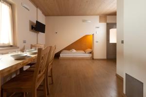 Postel nebo postele na pokoji v ubytování Hotel Meublè Adler - Rooms & Mountain Apartments
