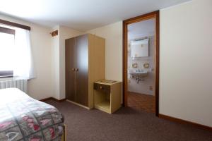 Postel nebo postele na pokoji v ubytování Hotel Meublè Adler - Rooms & Mountain Apartments
