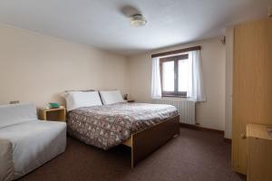 Postel nebo postele na pokoji v ubytování Hotel Meublè Adler - Rooms & Mountain Apartments