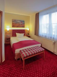 Ένα ή περισσότερα κρεβάτια σε δωμάτιο στο Burg Hotel Ziesar