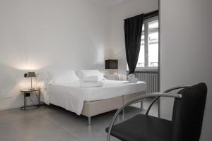 Ένα ή περισσότερα κρεβάτια σε δωμάτιο στο Il Vicolo Aparthotel Verona