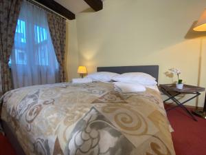 Posteľ alebo postele v izbe v ubytovaní P&J Apartamenty Św. Krzyża