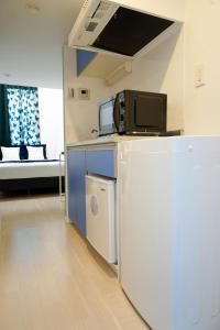 A kitchen or kitchenette at Blue Empire Hotel