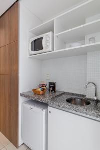 Kuchyň nebo kuchyňský kout v ubytování Citi Hotel Residence Caruaru