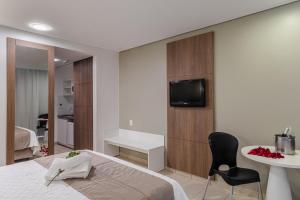 TV a/nebo společenská místnost v ubytování Citi Hotel Residence Caruaru