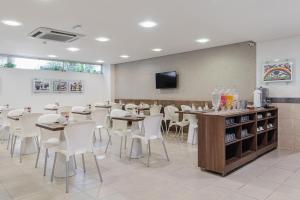 TV a/nebo společenská místnost v ubytování Citi Hotel Residence Caruaru