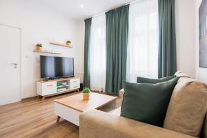 TV a/nebo společenská místnost v ubytování FAMILY Apartment OSTRAVA