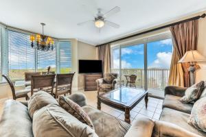 a living room with a couch and a table at Enchantment at Blue Heron in Orlando