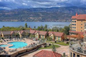 a view of a resort with a swimming pool at Tranquil Waterfront Condo in Kelowna