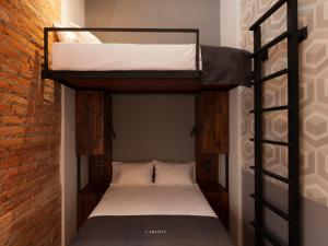 Voodi või voodid majutusasutuse Carlota Sustainable Design Hotel toas
