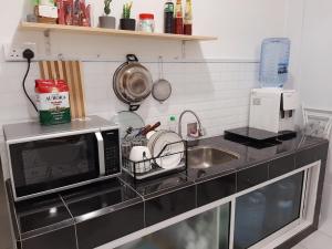 Kuchyň nebo kuchyňský kout v ubytování Miniinn Guest House + 15 fotografií