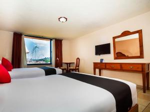 Postel nebo postele na pokoji v ubytování Hotel De La Loma