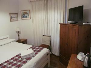 Postel nebo postele na pokoji v ubytování Lantern Guest House
