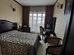 Кровать или кровати в номере Hotel Carol