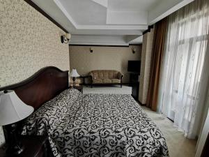 Кровать или кровати в номере Hotel Carol
