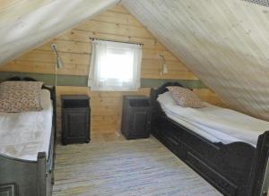 Postel nebo postele na pokoji v ubytování Fröya Timber Cottage
