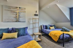 a room with two beds and a ladder at Refurbished Central Premium Property in Sheffield