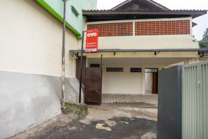 an entrance to a building with a do not enter sign at Super OYO 3209 Hegarbudhi Residence in Bandung