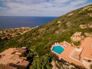 an aerial view of a house and the ocean at Casa Rosa Arancio in Costa Paradiso
