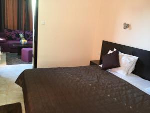Ένα ή περισσότερα κρεβάτια σε δωμάτιο στο Salt Lake ApartHotel