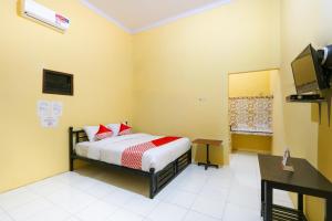 Кровать или кровати в номере OYO 3100 El Shaday Family Residence