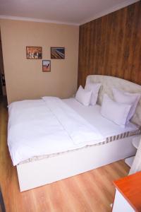 Säng eller sängar i ett rum på Altair Hotel