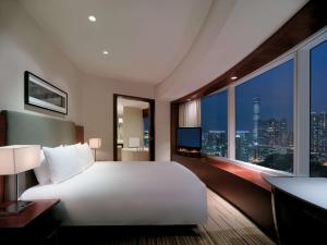Postelja oz. postelje v sobi nastanitve Hyatt Regency Hong Kong Tsim Sha Tsui