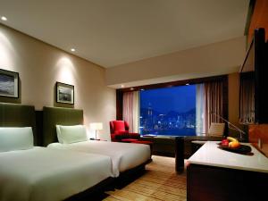 Postelja oz. postelje v sobi nastanitve Hyatt Regency Hong Kong Tsim Sha Tsui
