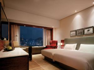 Postelja oz. postelje v sobi nastanitve Hyatt Regency Hong Kong Tsim Sha Tsui