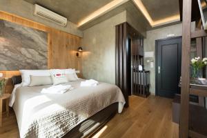 Posteľ alebo postele v izbe v ubytovaní Tsikeli Boutique Hotel Meteora - Adults Friendly