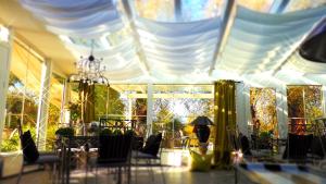 a room with tables and chairs and a white ceiling at Drahthammer Schlößl in Amberg +39 photos