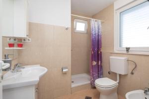 Koupelna v ubytování Beach Apartments "Bili Cvitak"