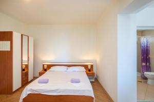Postel nebo postele na pokoji v ubytování Beach Apartments "Bili Cvitak"