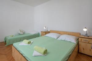 Postel nebo postele na pokoji v ubytování Beach Apartments "Bili Cvitak"